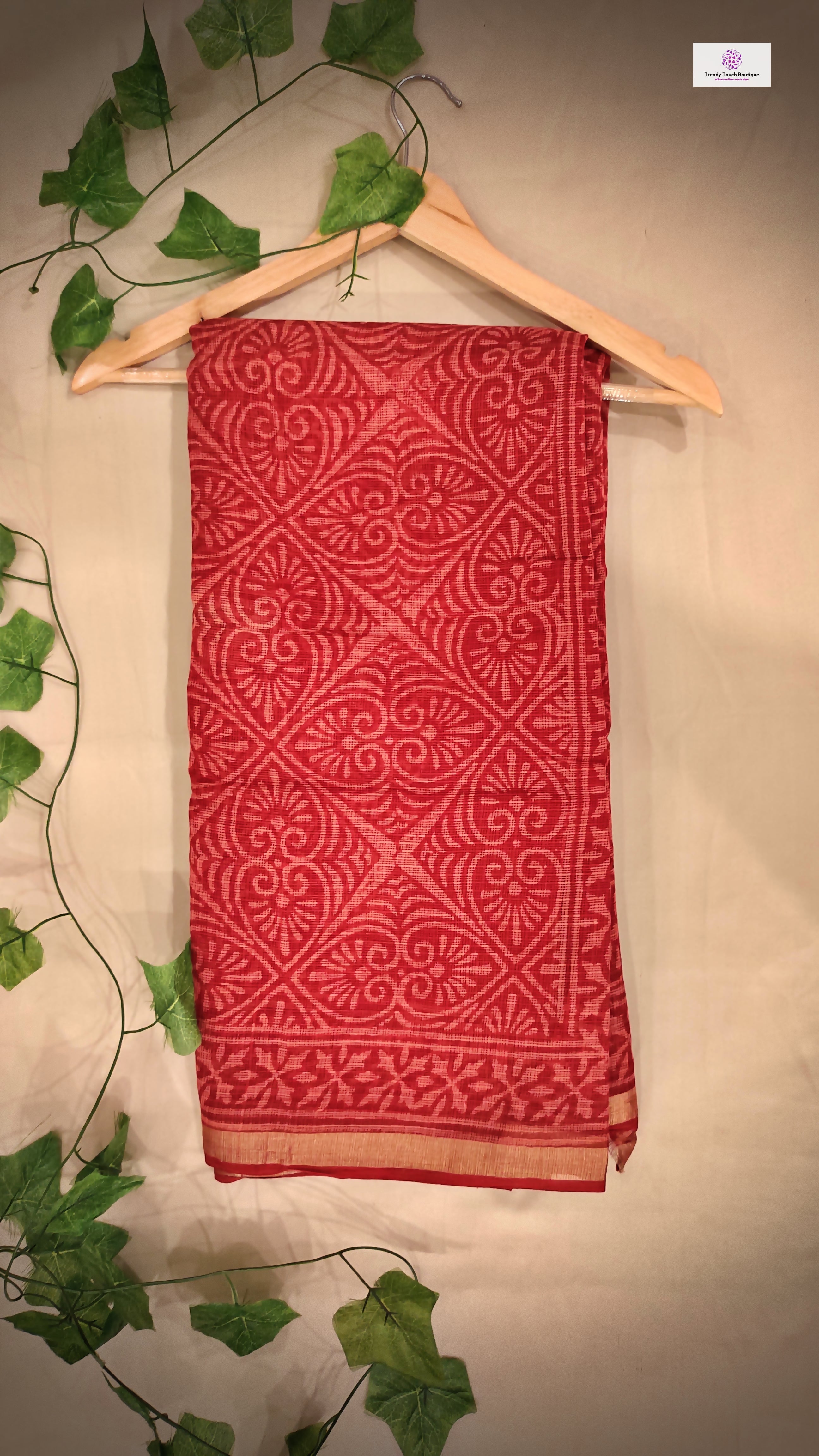 Hand block printed maroon Kota Doria saree with natural dyes, floral and paisley patterns, lightweight and skin-friendly.