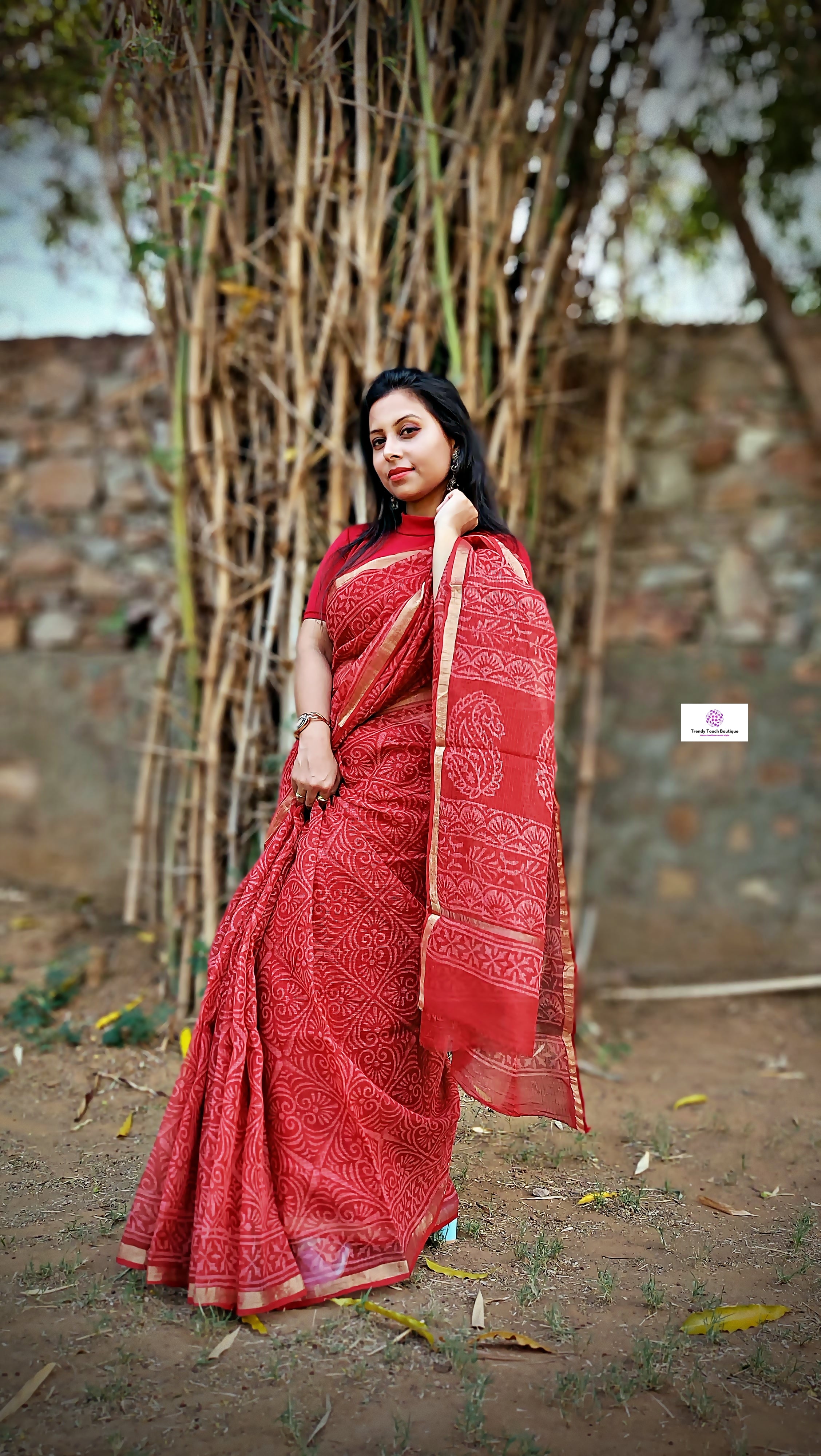 Hand block printed maroon Kota Doria saree with natural dyes, floral and paisley patterns, lightweight and skin-friendly.